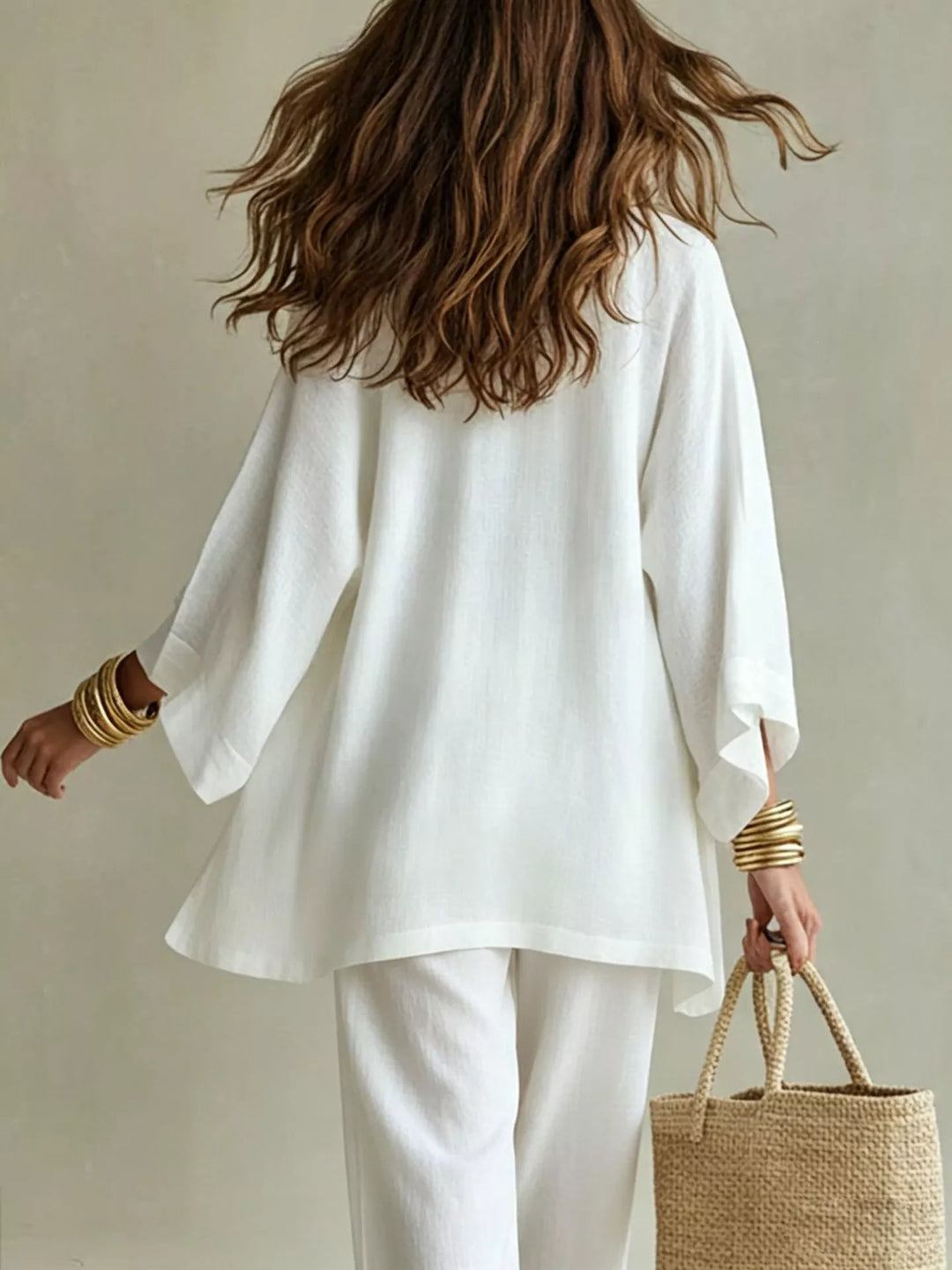 Three piece v neck top, cardigan and pants in white, back view
