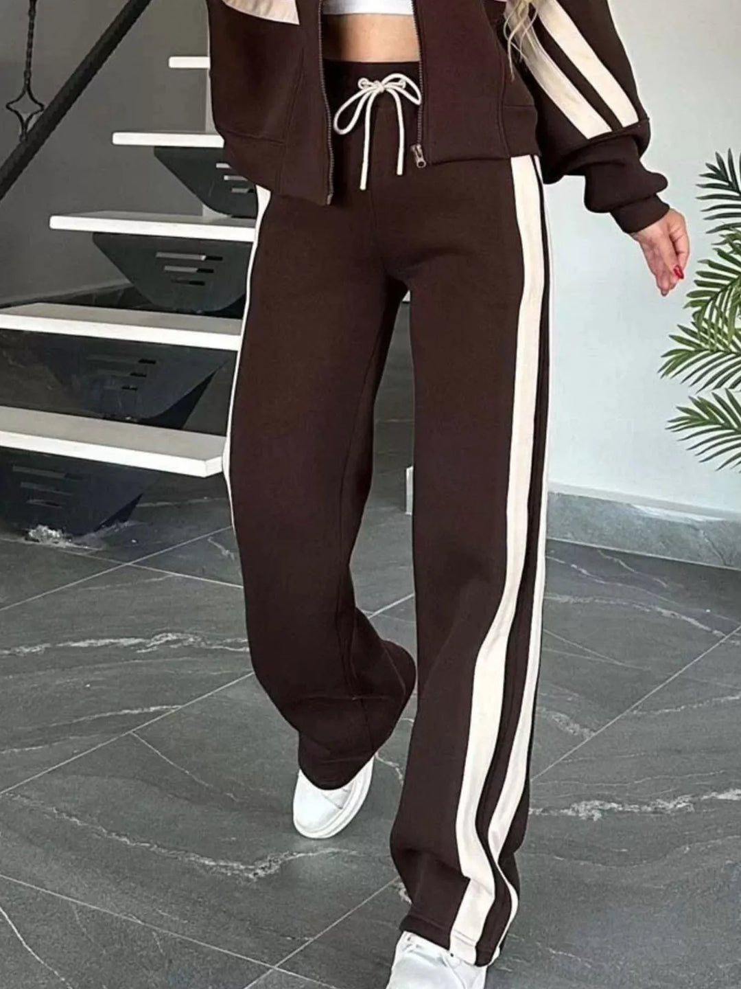 Chocolate brown tracksuit pants with side stripe and white sneakers