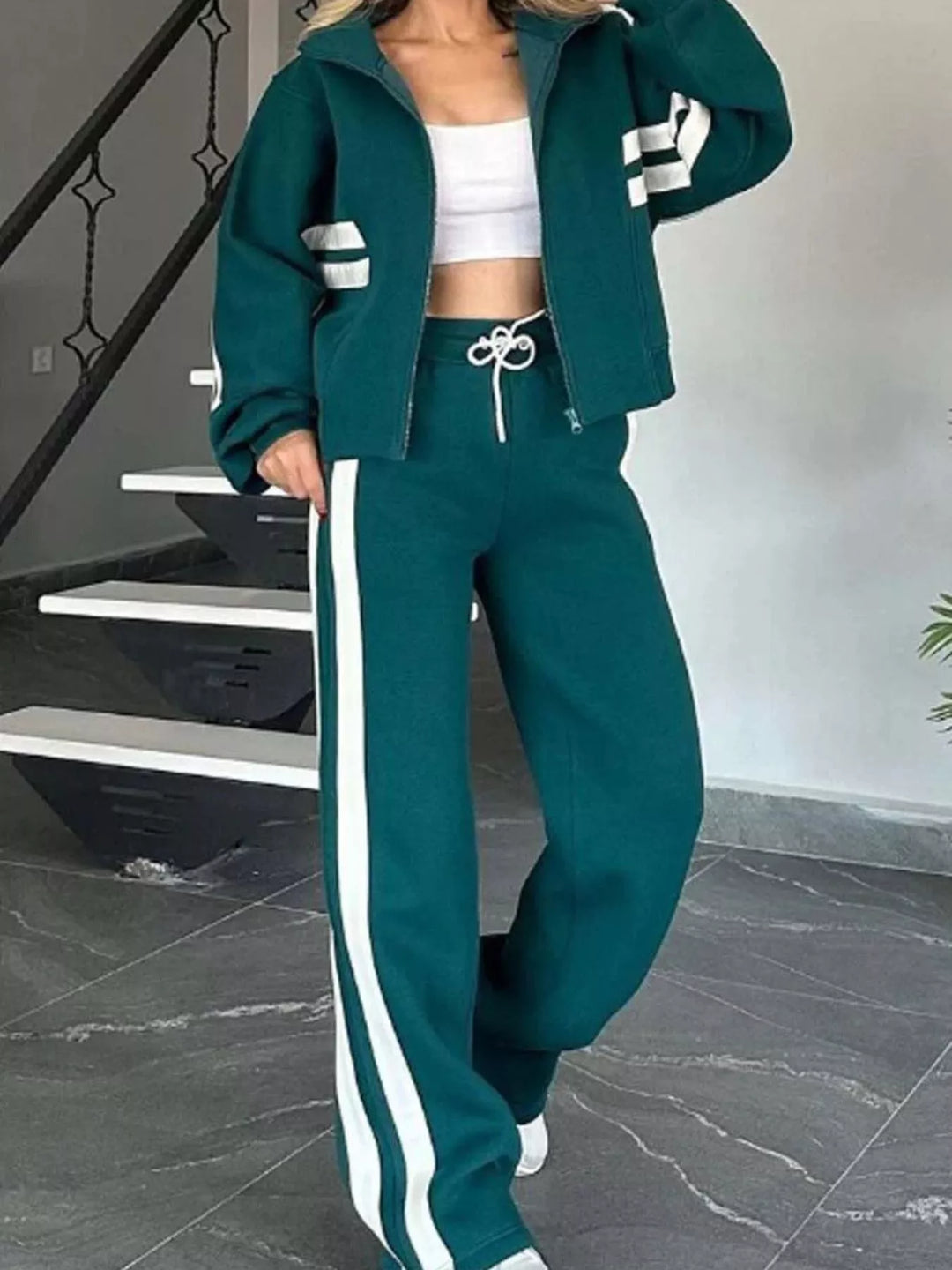 Teal matching tracksuit set with zip up jacket and white striped pants