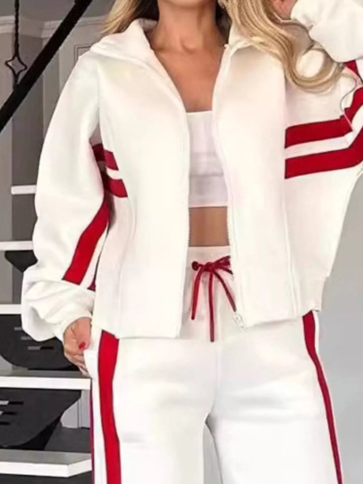 Close-up of the white zip up jacket with red sleeve stripes and red drawstring