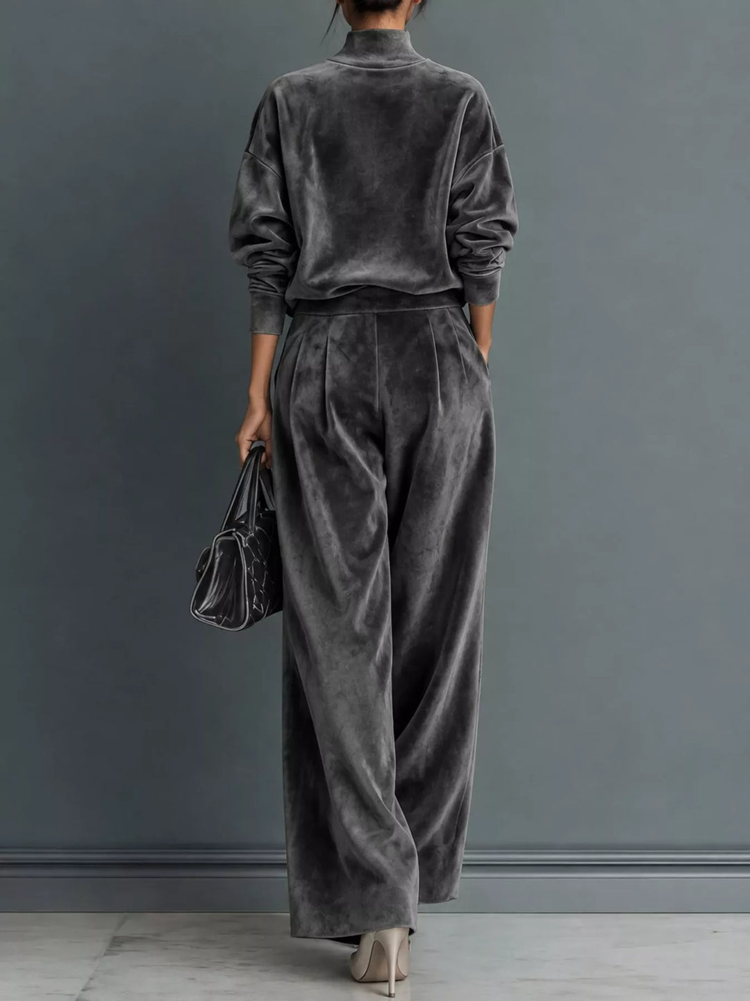 Velvet-look mock neck top and wide leg pants in dark gray, styled on model