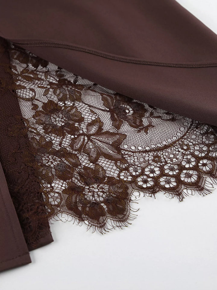 Floral lace trim peeking out from the slit of the chocolate brown skirt