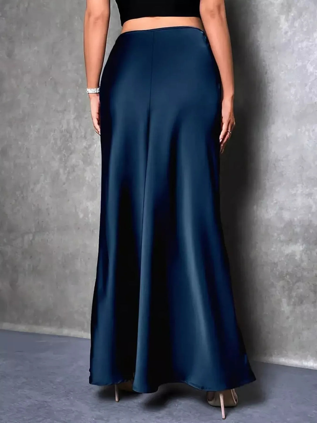Back view of the peacock blue high waisted maxi skirt with a smooth fit
