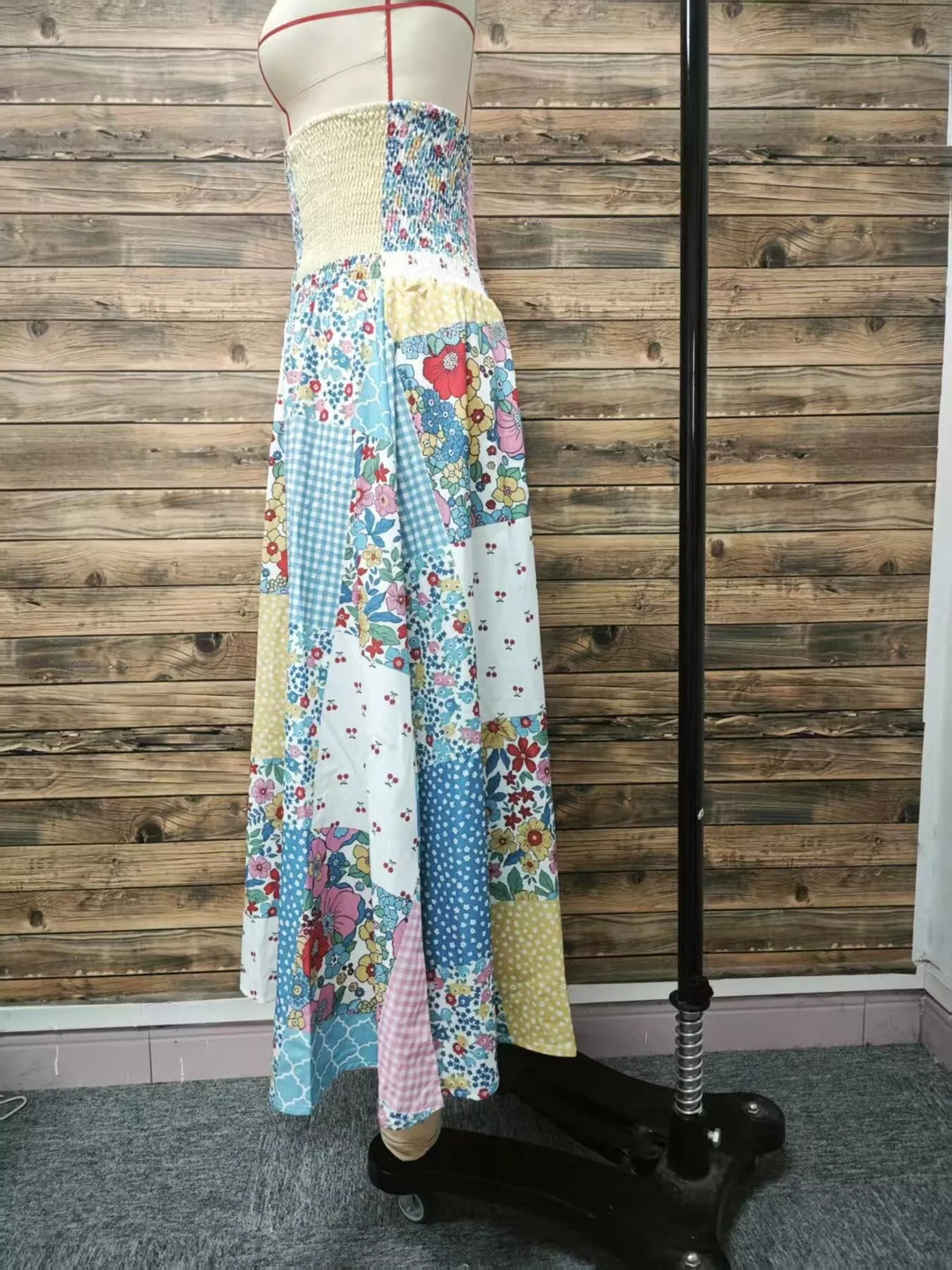 Side view of the tiered patchwork maxi skirt on a mannequin