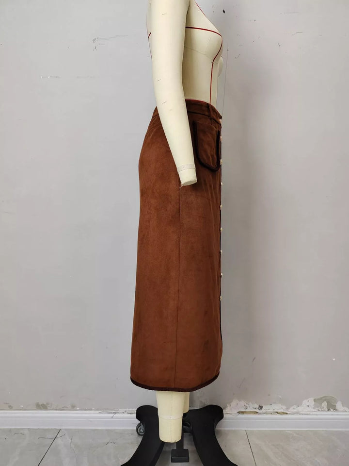 Side view of the rust A line midi skirt on a mannequin