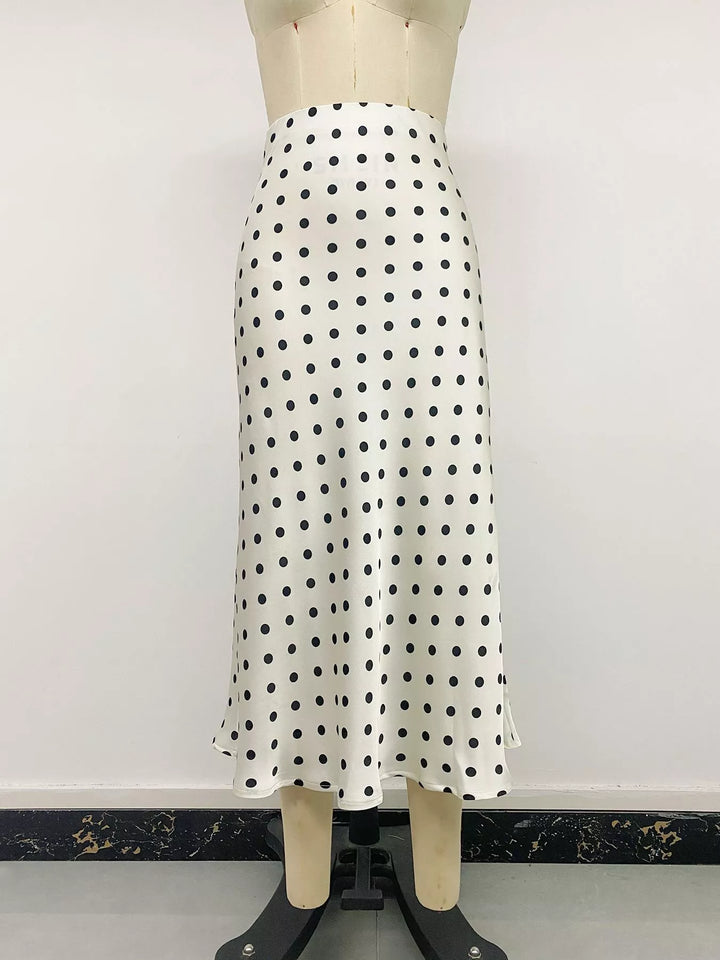 Cream polka dot midi skirt front view on a mannequin