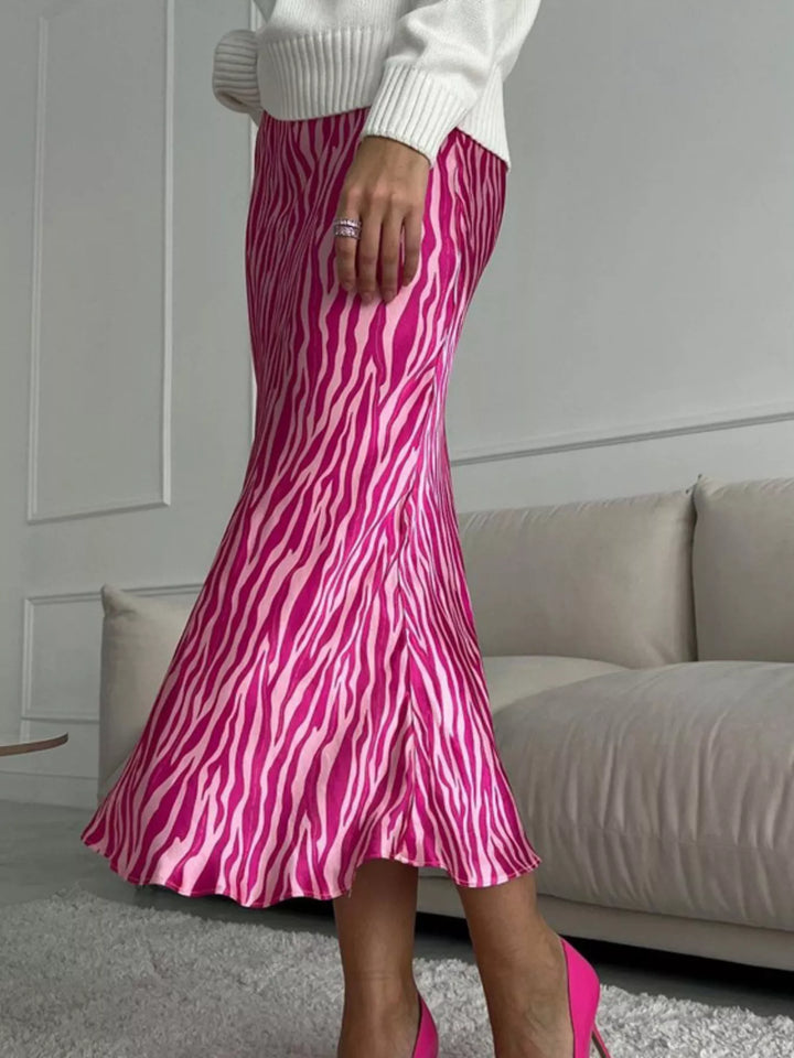 Hot pink satin-look skirt in motion with the hem swirling