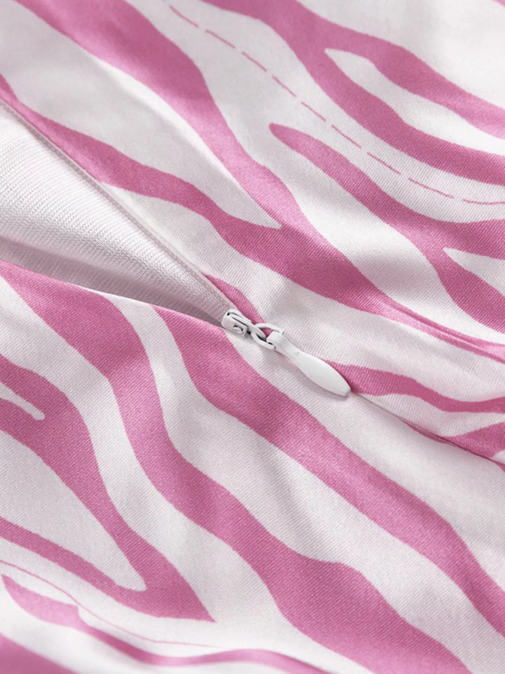 Close-up of the zebra print and hidden zipper on the light pink skirt