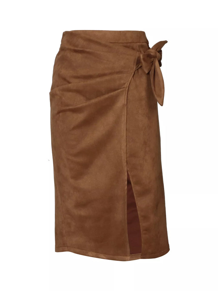 Flat view of the camel brown wrap midi skirt with front slit and bow