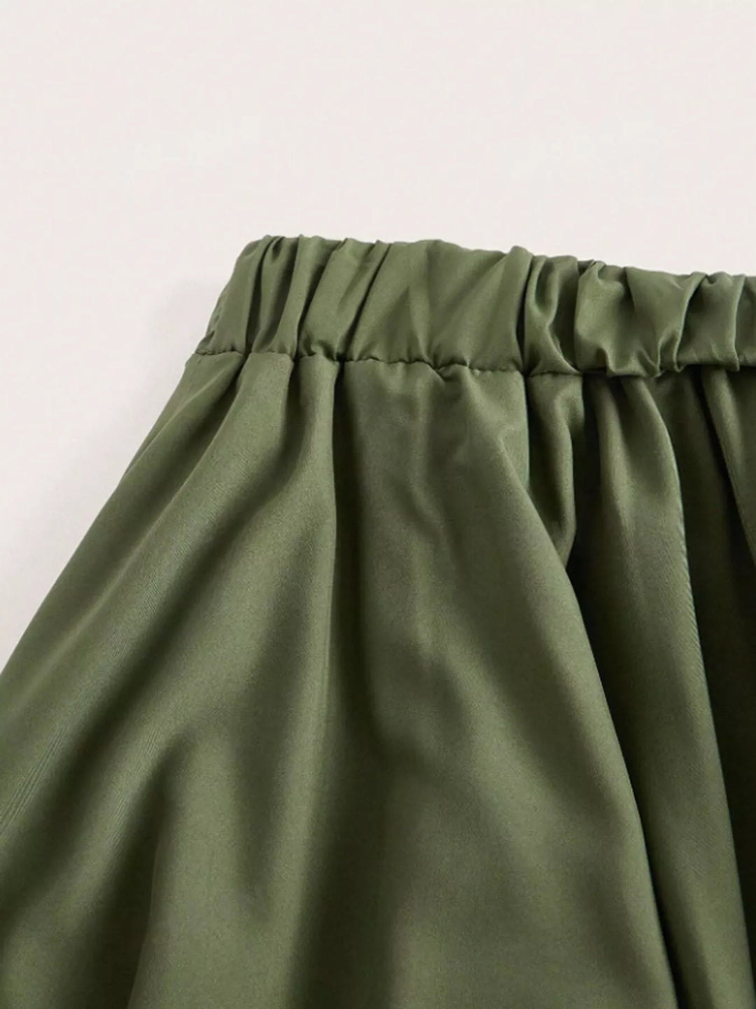 Tiered handkerchief hem lace trim plus size in army green, close-up detail