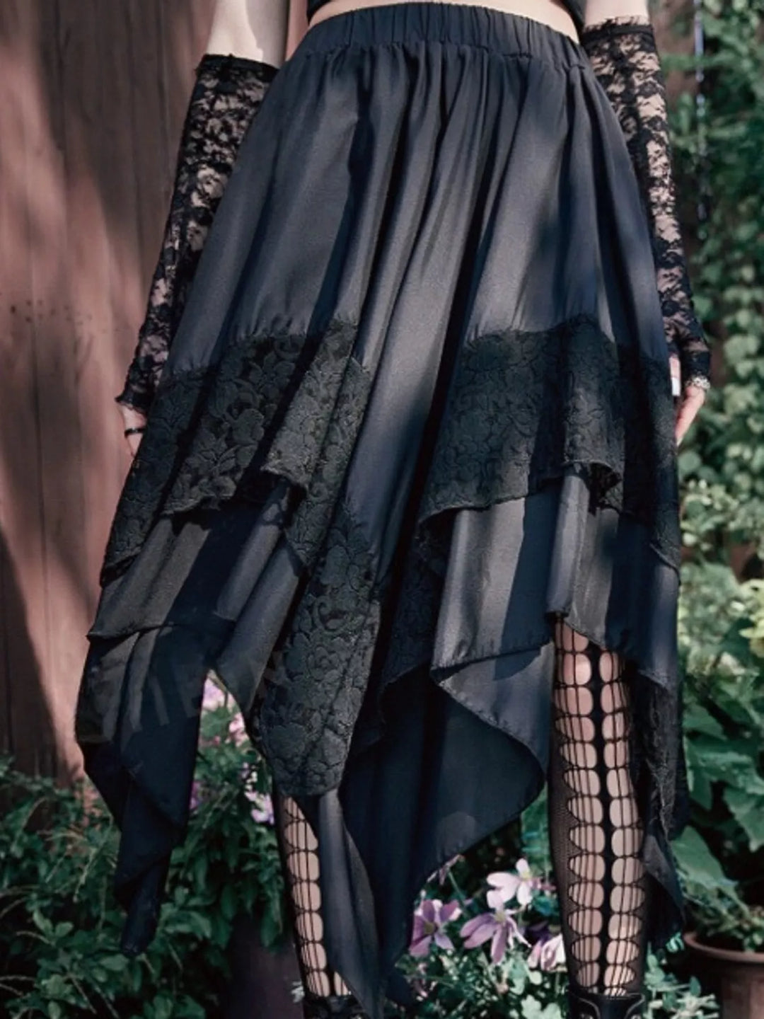 Tiered handkerchief hem lace trim plus size in black, styled on model 2