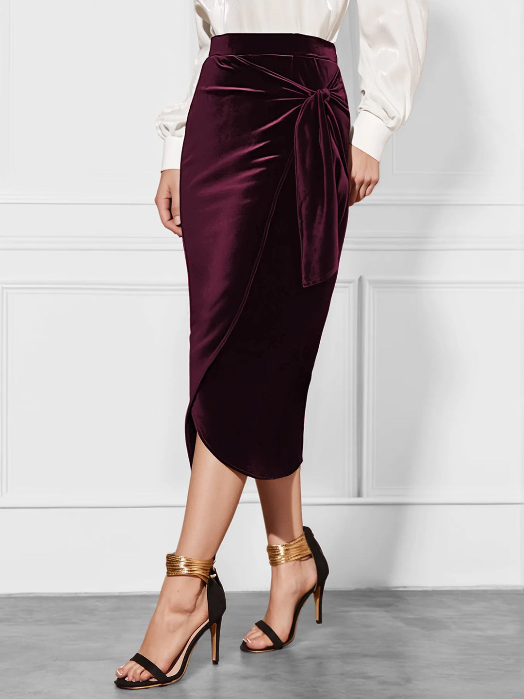 Women's burgundy midi skirt with velvet-look wrap front, slit and bow, front view