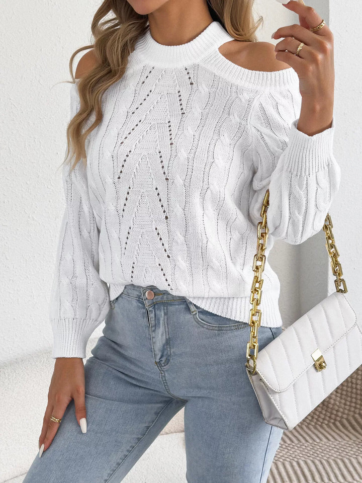 White mock neck sweater styled with jeans and a quilted chain bag