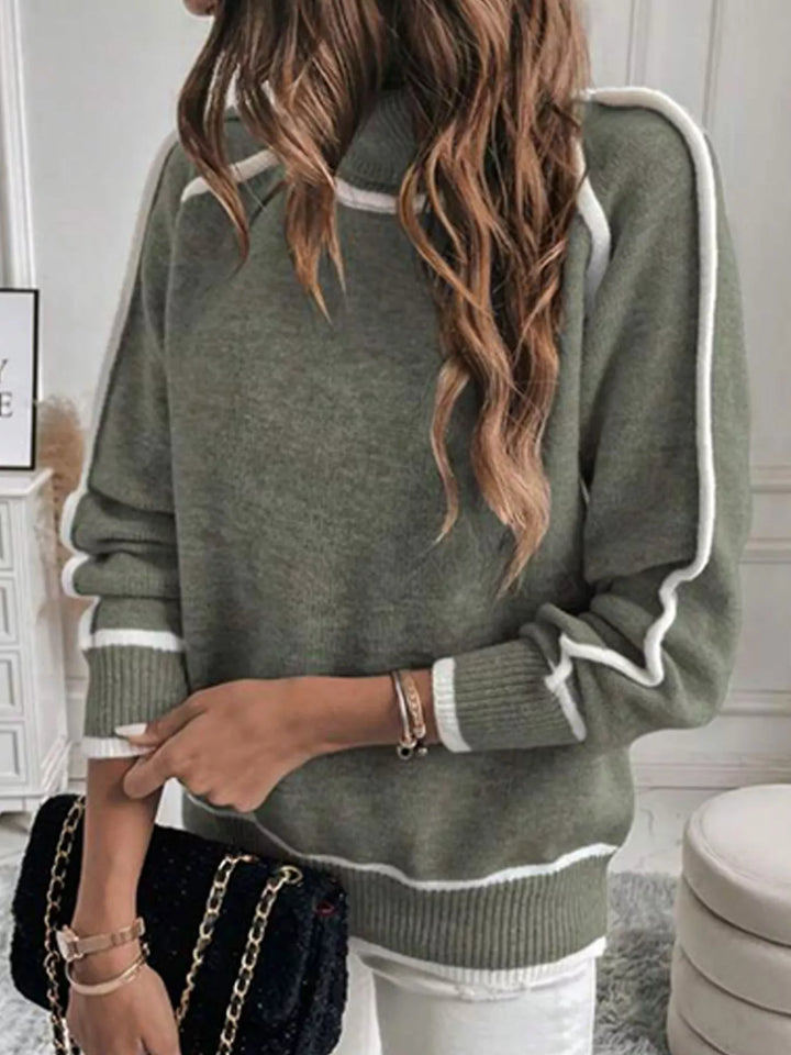 Olive raglan sleeve sweater styled with white jeans and a black chain bag
