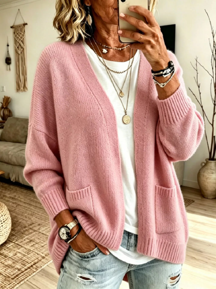 Women's open front cardigan in dusty pink, oversized V neck with pockets, over a white tee