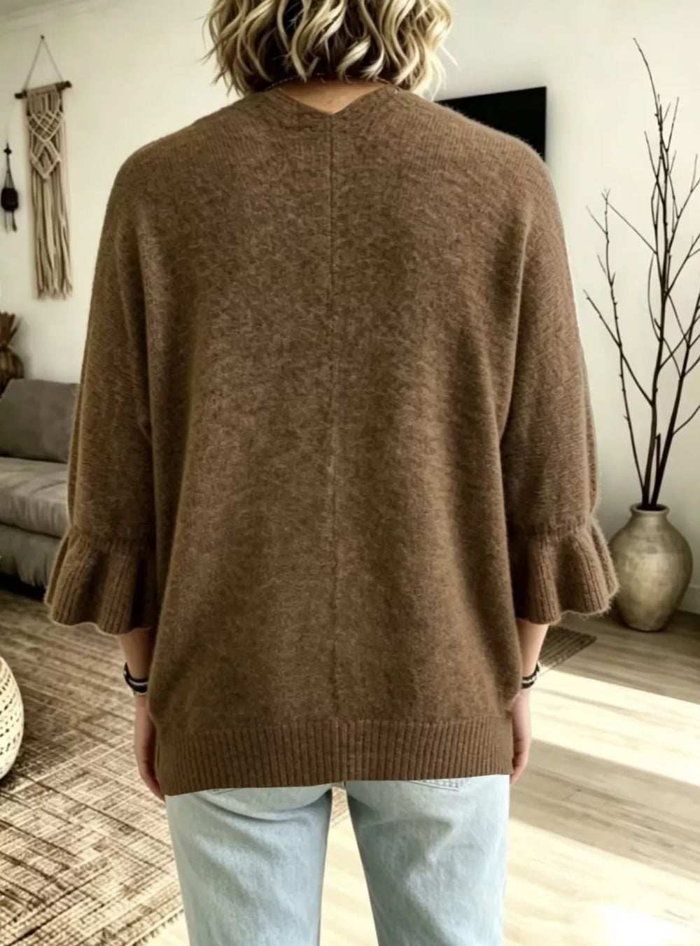 Back view of the brown relaxed cardigan with ruffled sleeve ends