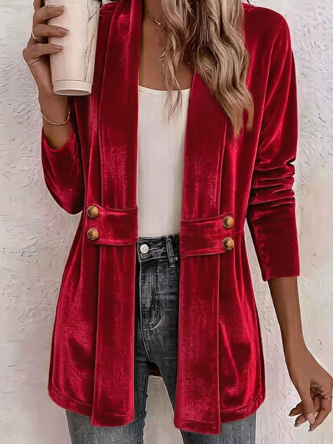 Red velvet-look open front cardigan with belted waist, styled with jeans
