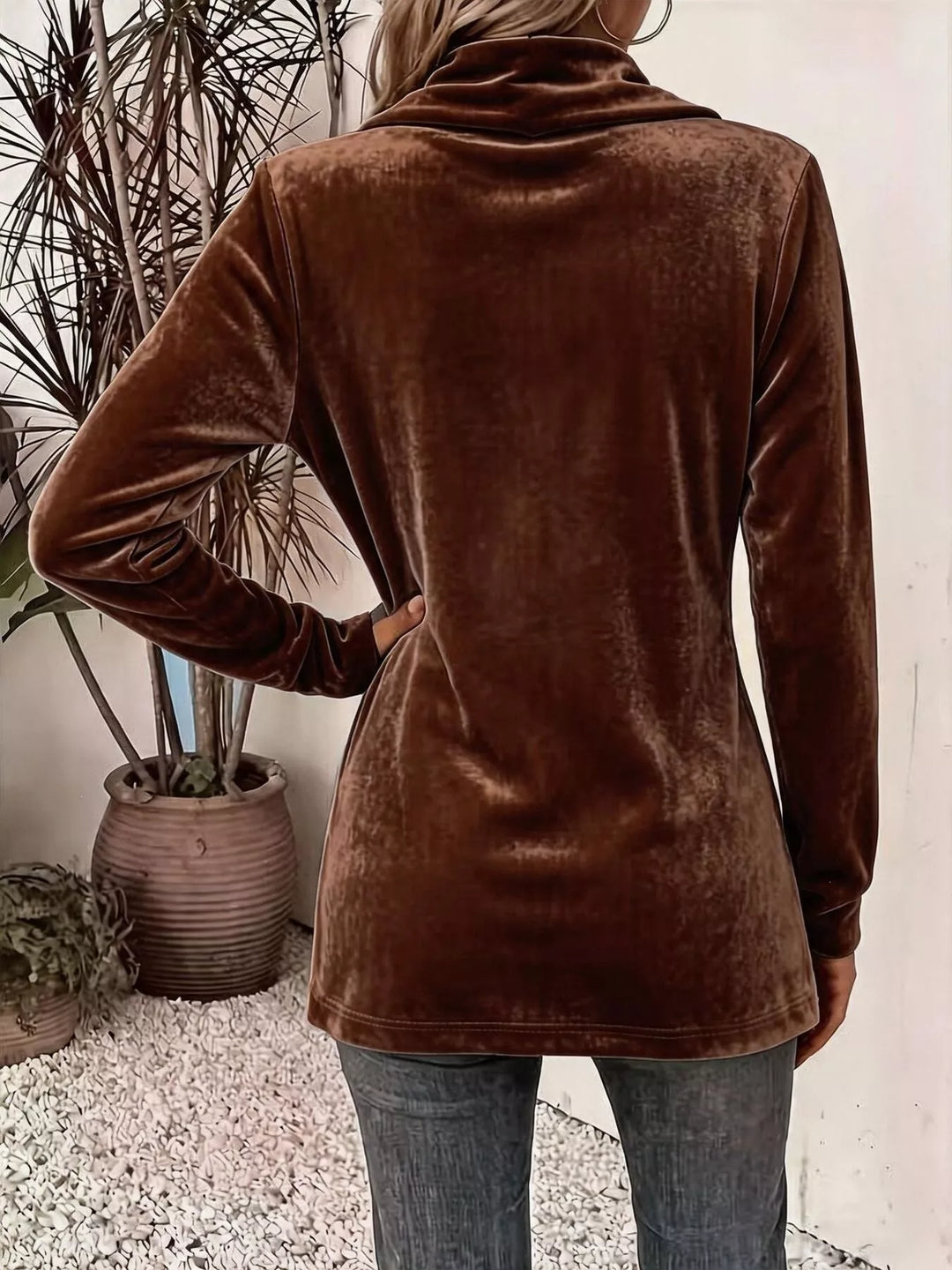 Back view of the rust brown shawl collar cardigan worn with jeans