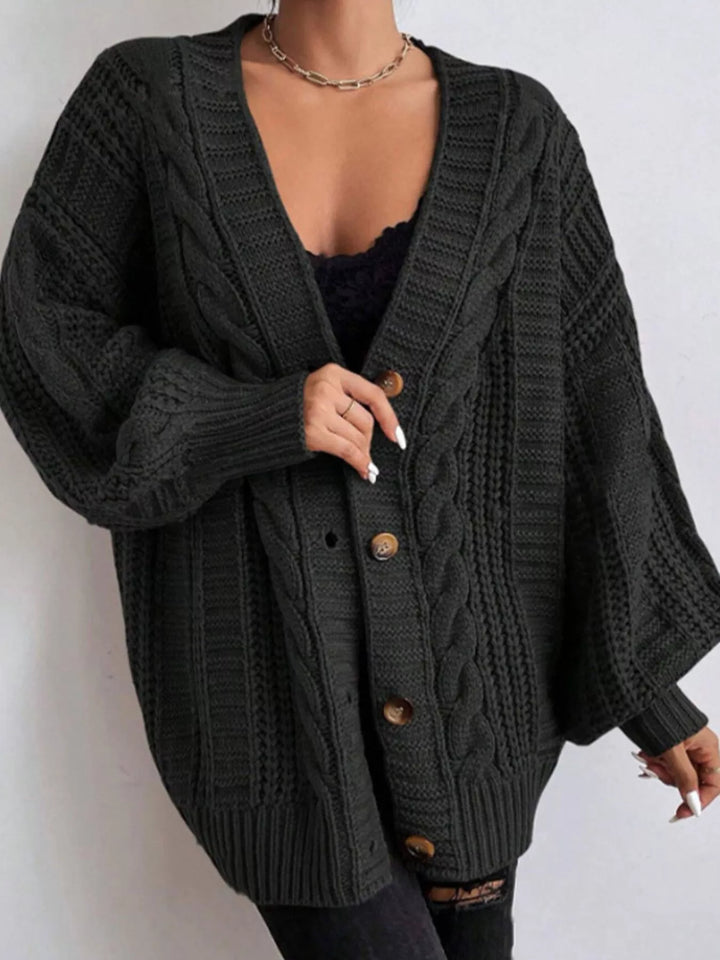 Close-up of the black V neck cardigan with brown buttons