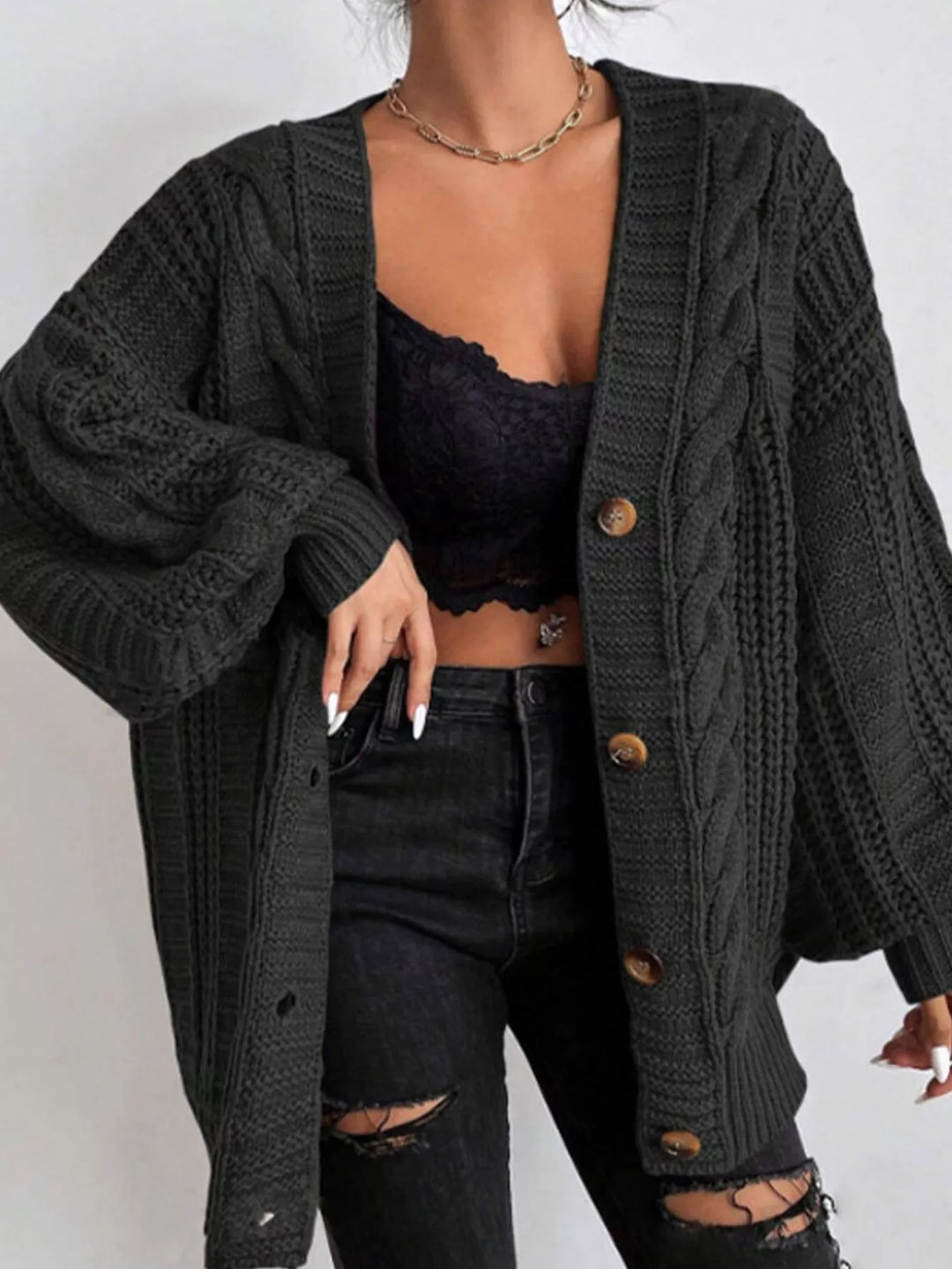 Black cable knit oversized cardigan with balloon sleeves, front view