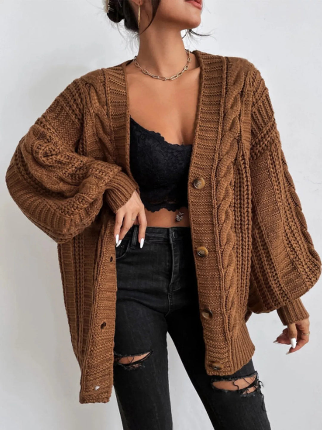 Rust cable knit cardigan with balloon sleeves and V neck, front view