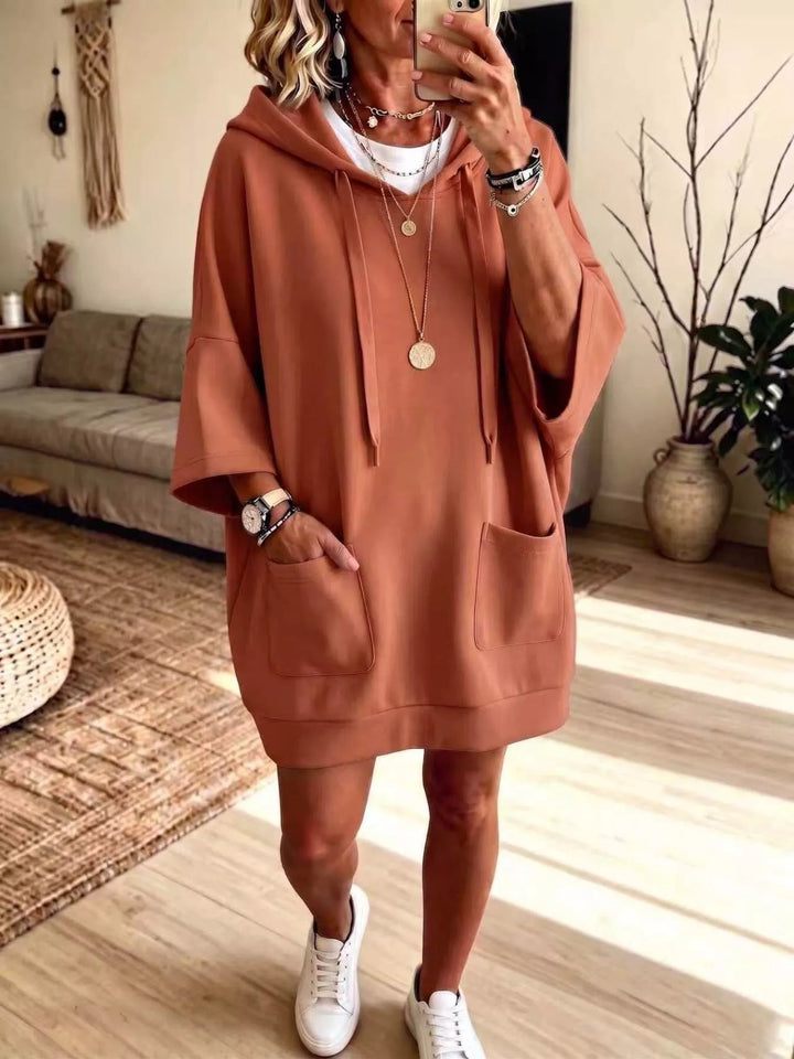 Dress-length wide sleeves big front pocket in terracotta, front view