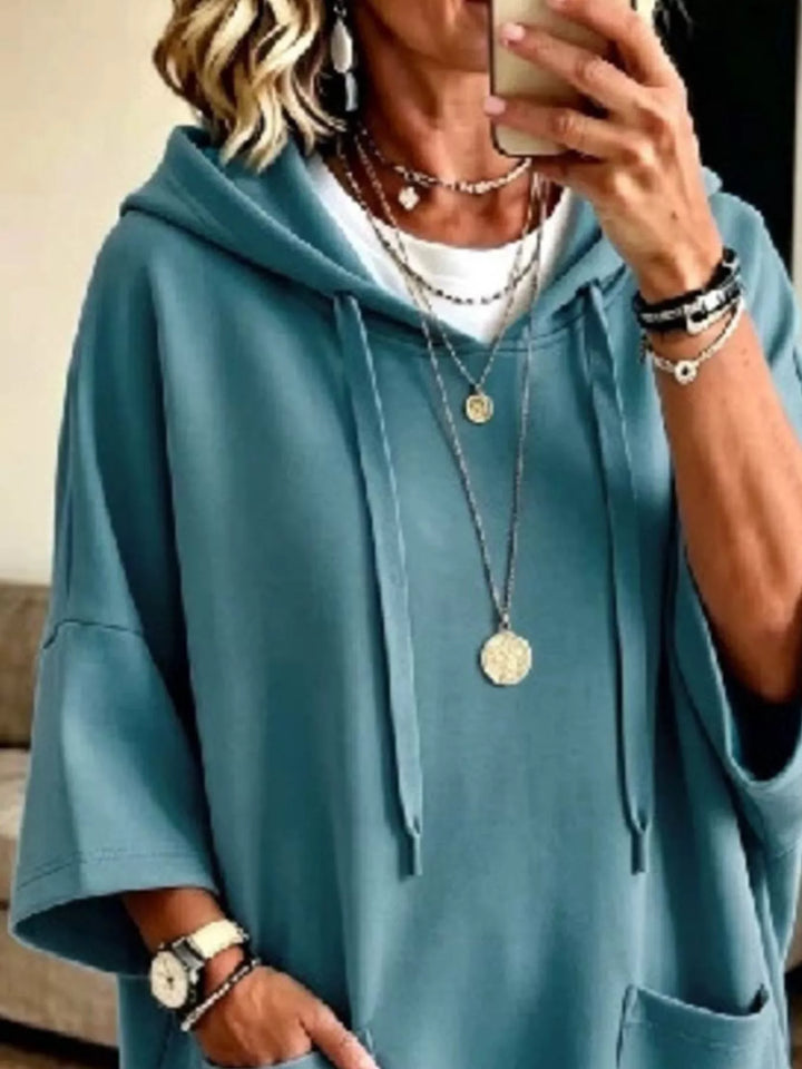 Dress-length wide sleeves big front pocket in turquoise, close-up detail 2