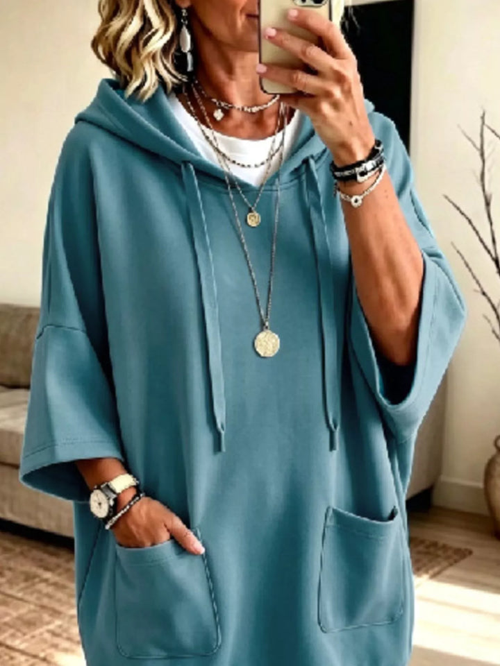 Dress-length wide sleeves big front pocket in turquoise, close-up detail
