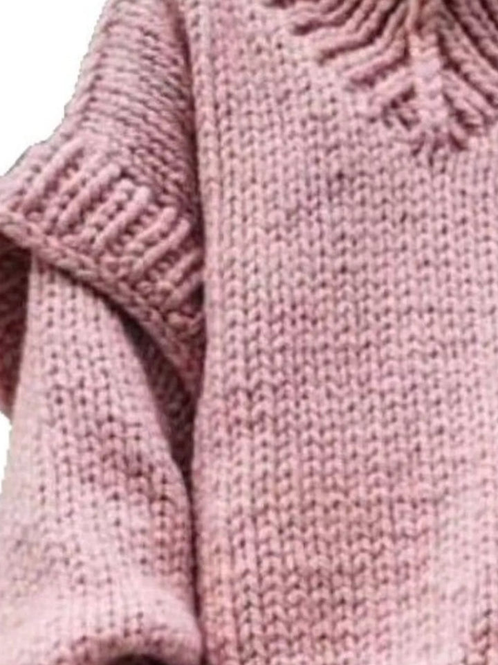 Close-up of the pink chunky knit and layered shoulder detail