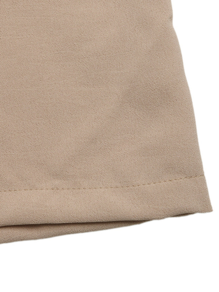 Close-up of the tan palazzo pants hem stitching