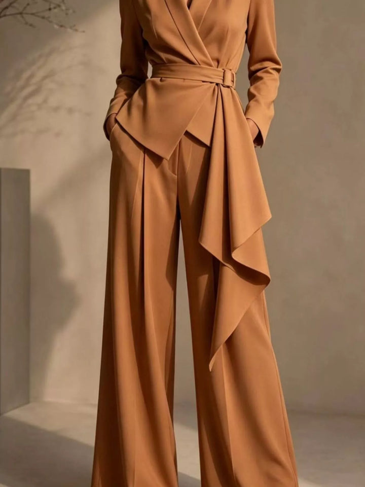 Caramel wide leg pants and wrap blazer with cascading ruffle drape, standing pose