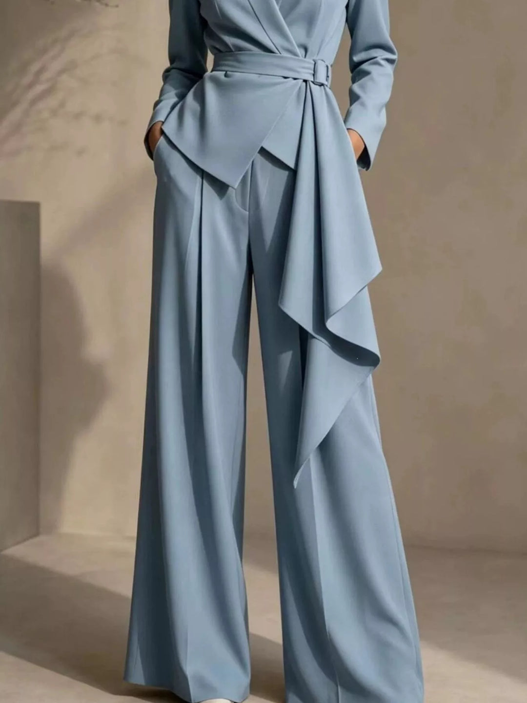 Light blue wide leg pants with draped belt panel, long view of the pant suit