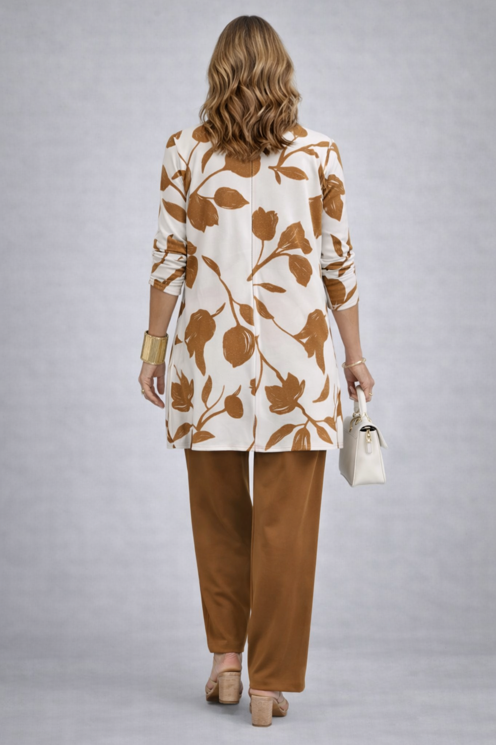 Back view of the caramel tulip and vine print cardigan with a center seam