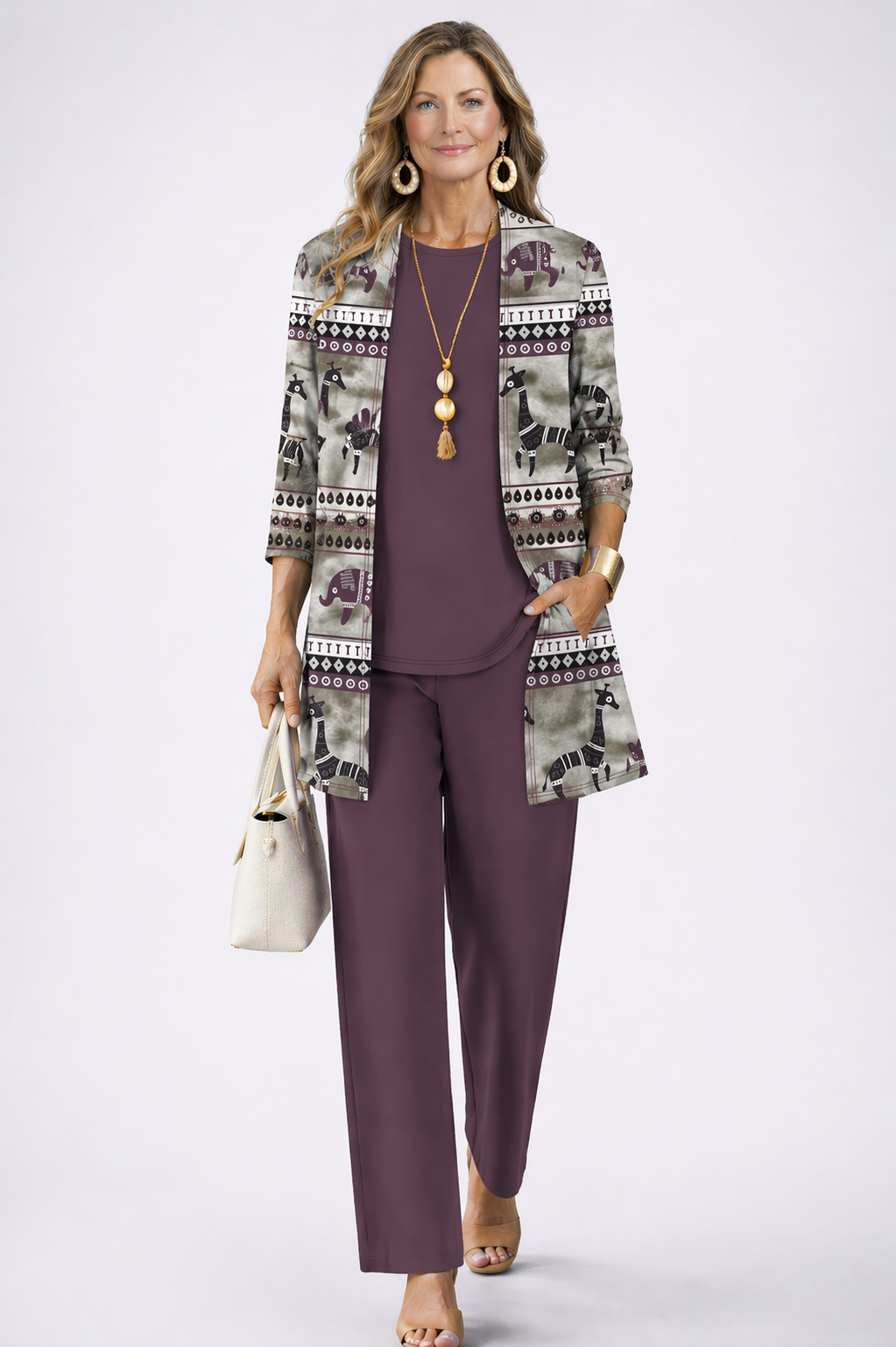 Women's pant suit in plum with an elephant and giraffe print cardigan, plum top and straight pants