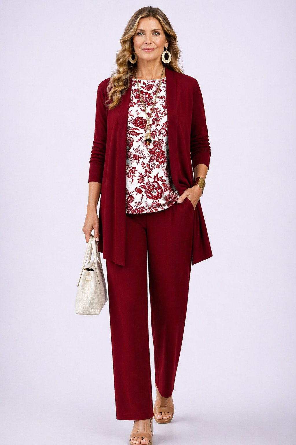 Women's pant suit in burgundy, floral print top with open cardigan and straight leg pants