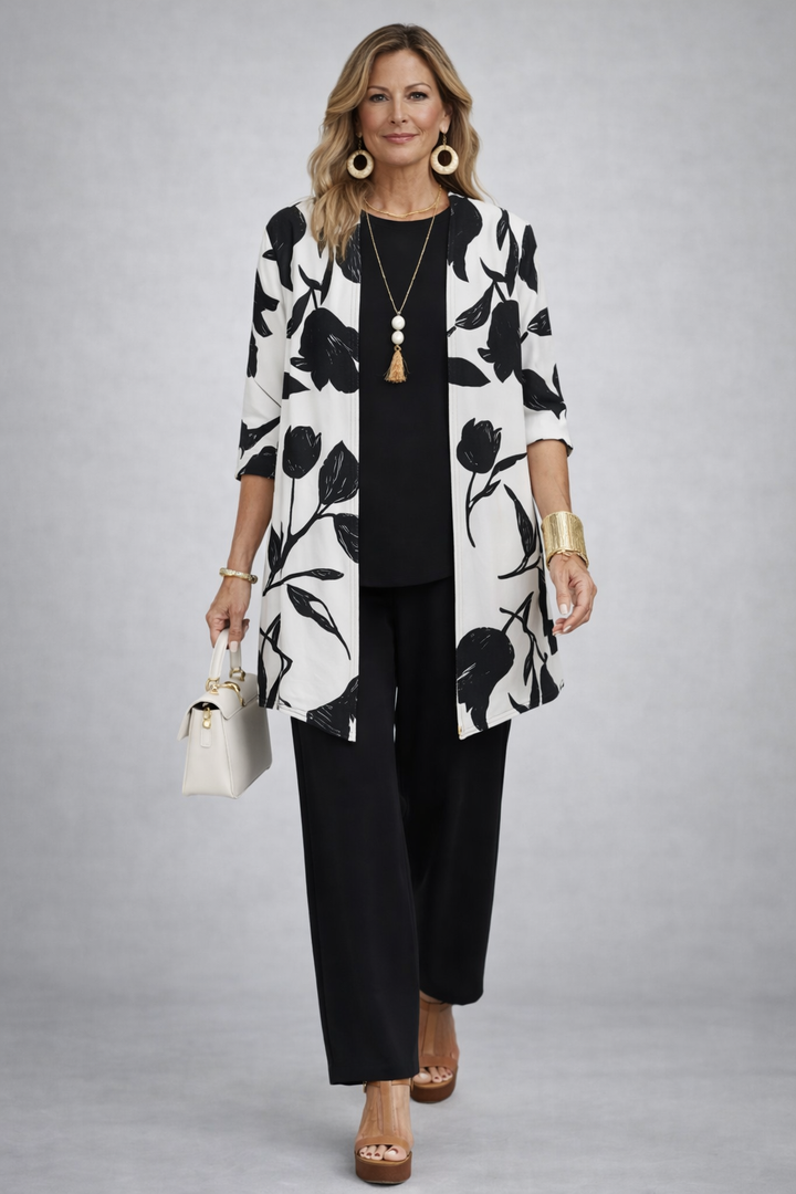 Women's pant suit in black with an ivory floral print longline cardigan and straight pants