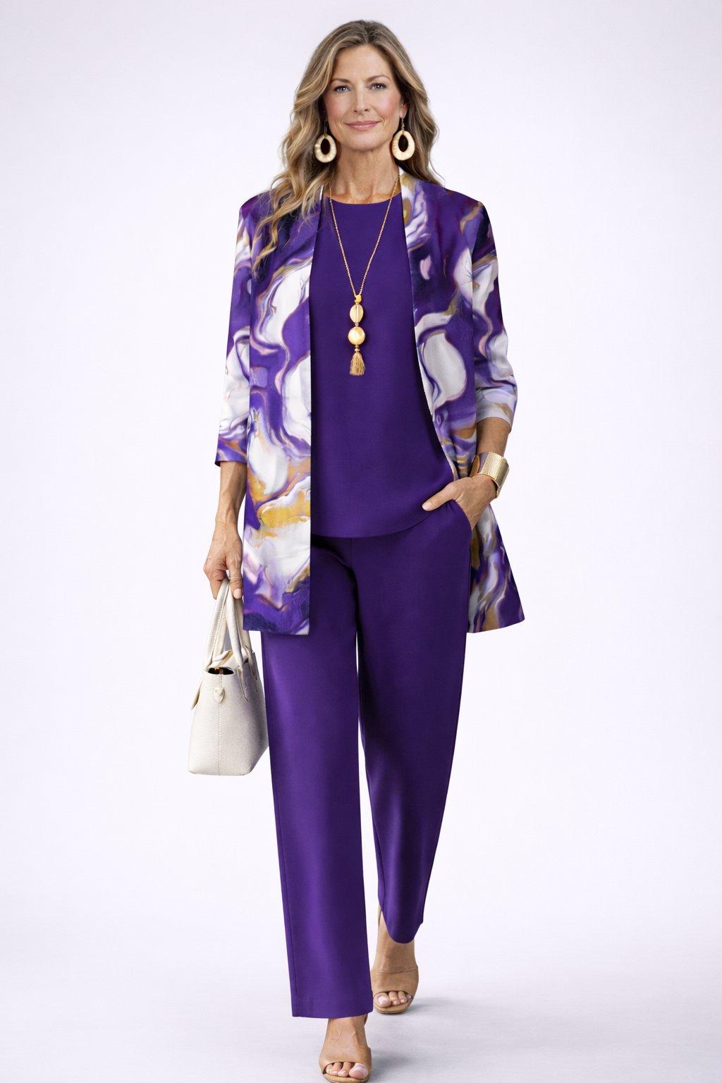 Women's pant suit in purple with a liquid swirl print cardigan, purple top and straight pants