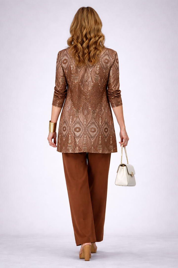 Back view of the shimmering feather print cardigan over rust pants