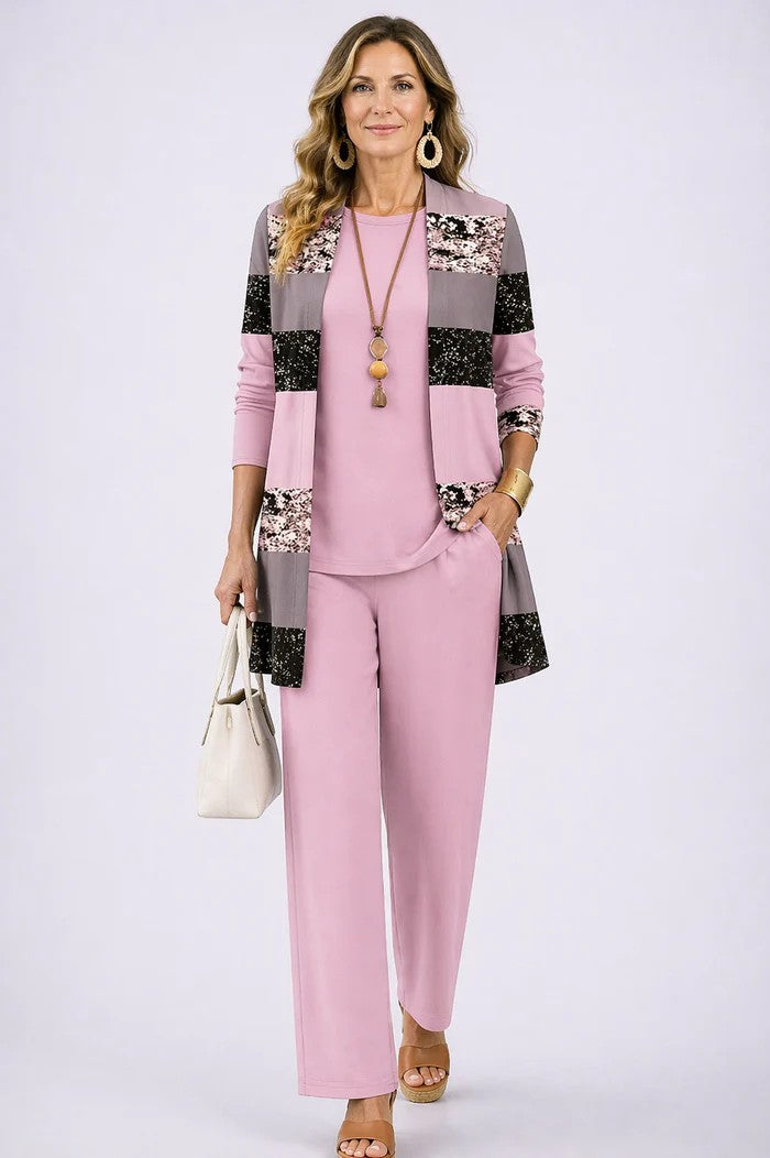 Pink patchwork block print cardigan over a solid pink top and pants