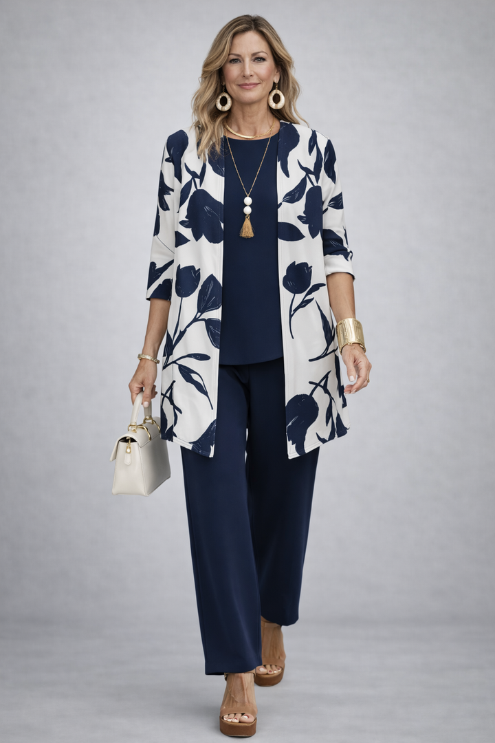 Women's pant suit in navy with an ivory tulip print cardigan, navy top and straight pants