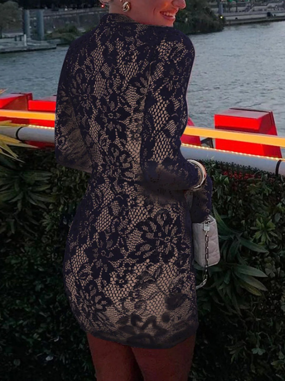 Black mini dress worn on a model, showing the high neck
