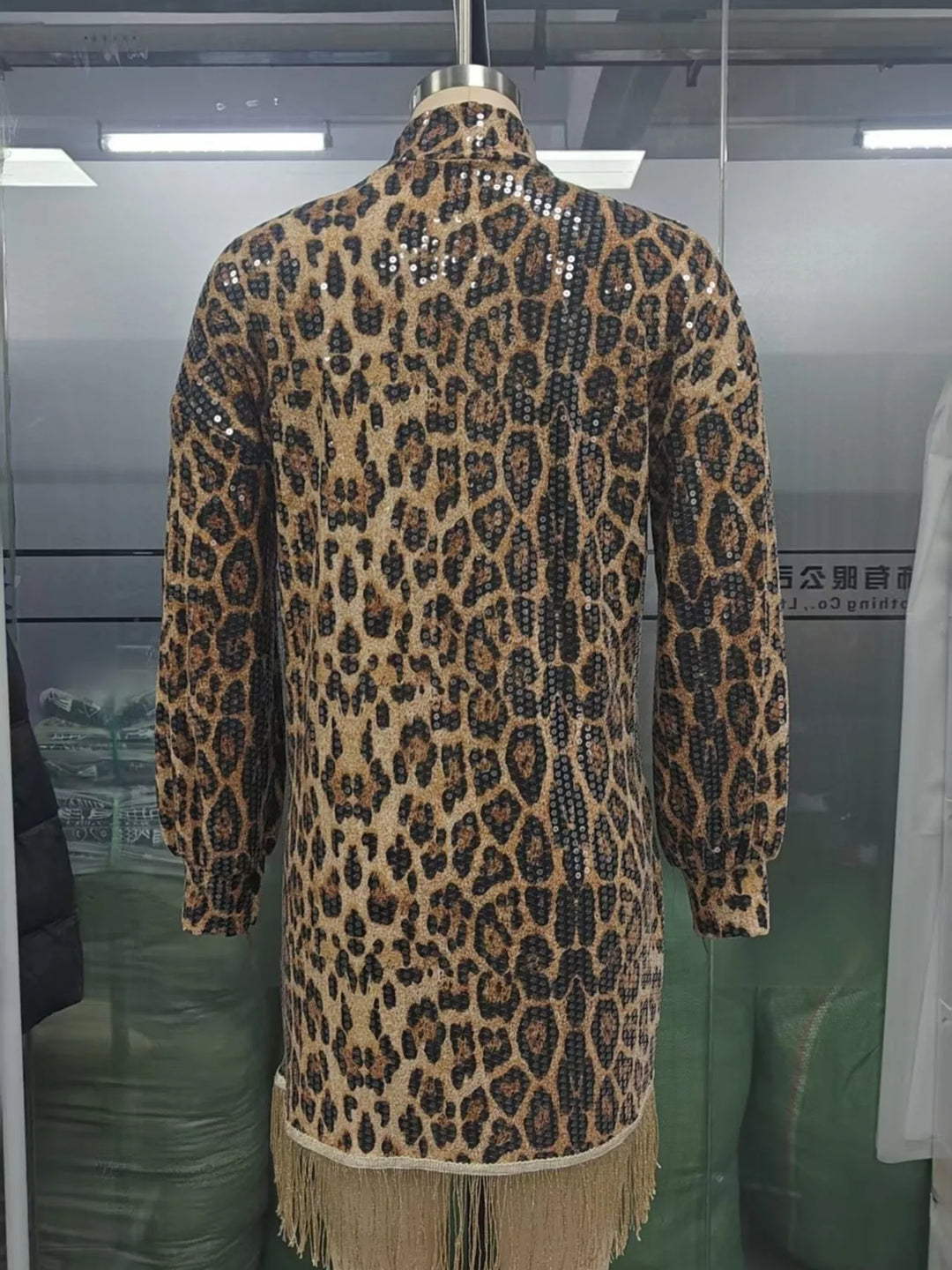 Leopard mini dress shown flat with mock neck