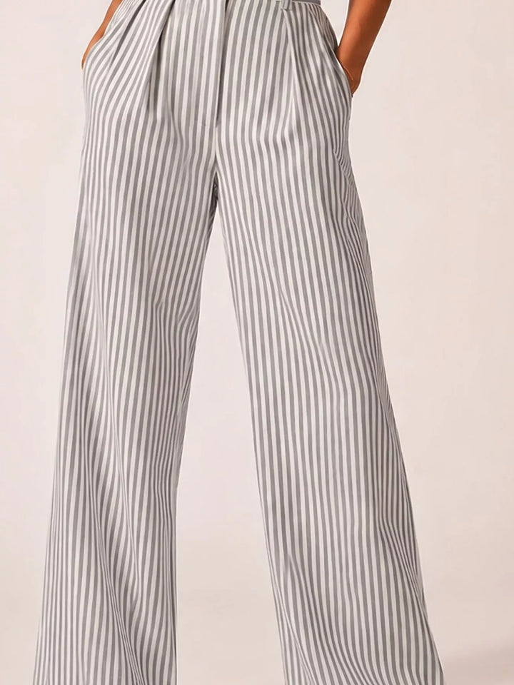 Gray pinstripe high waisted pants, close-up of the waistband and pleated front
