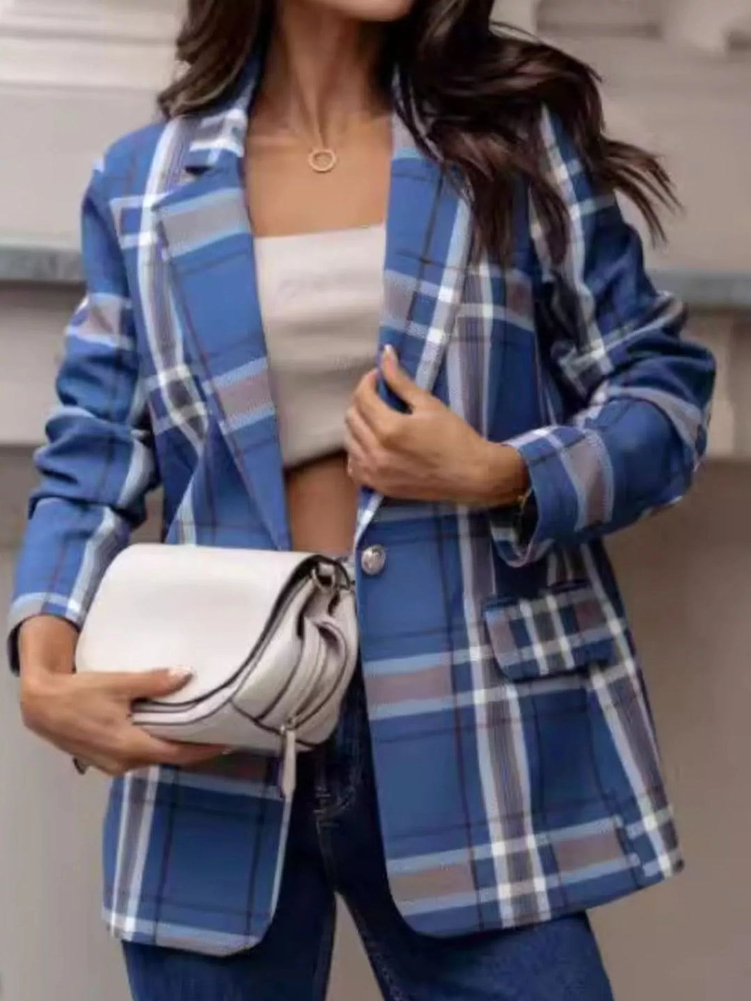 Notch lapels button front lined in sky blue, styled on model