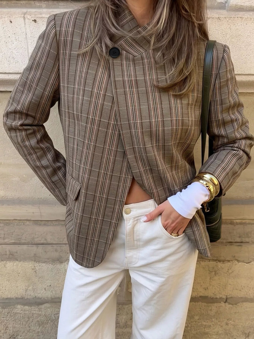Mocha plaid blazer single button front with hands in pockets, torso view