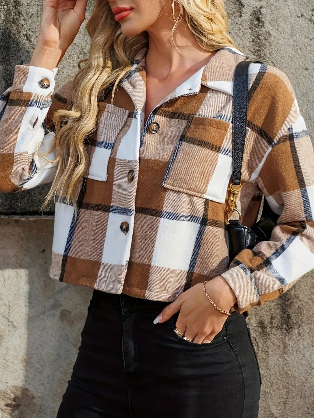 Caramel plaid jacket with button front and chest pocket, hand in pocket