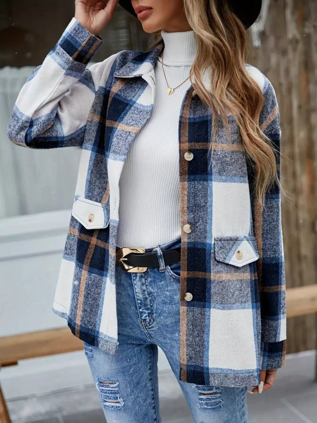 Women's plaid shacket in navy plaid with collared button front, styled with jeans