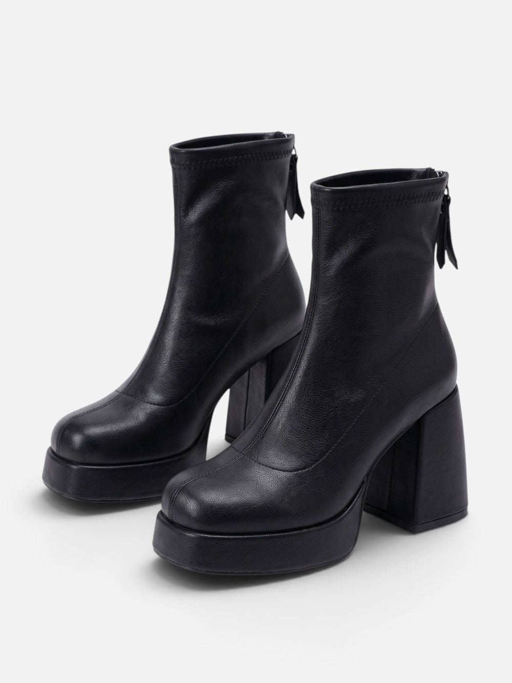 Black platform ankle boots with thick sole and glossy finish