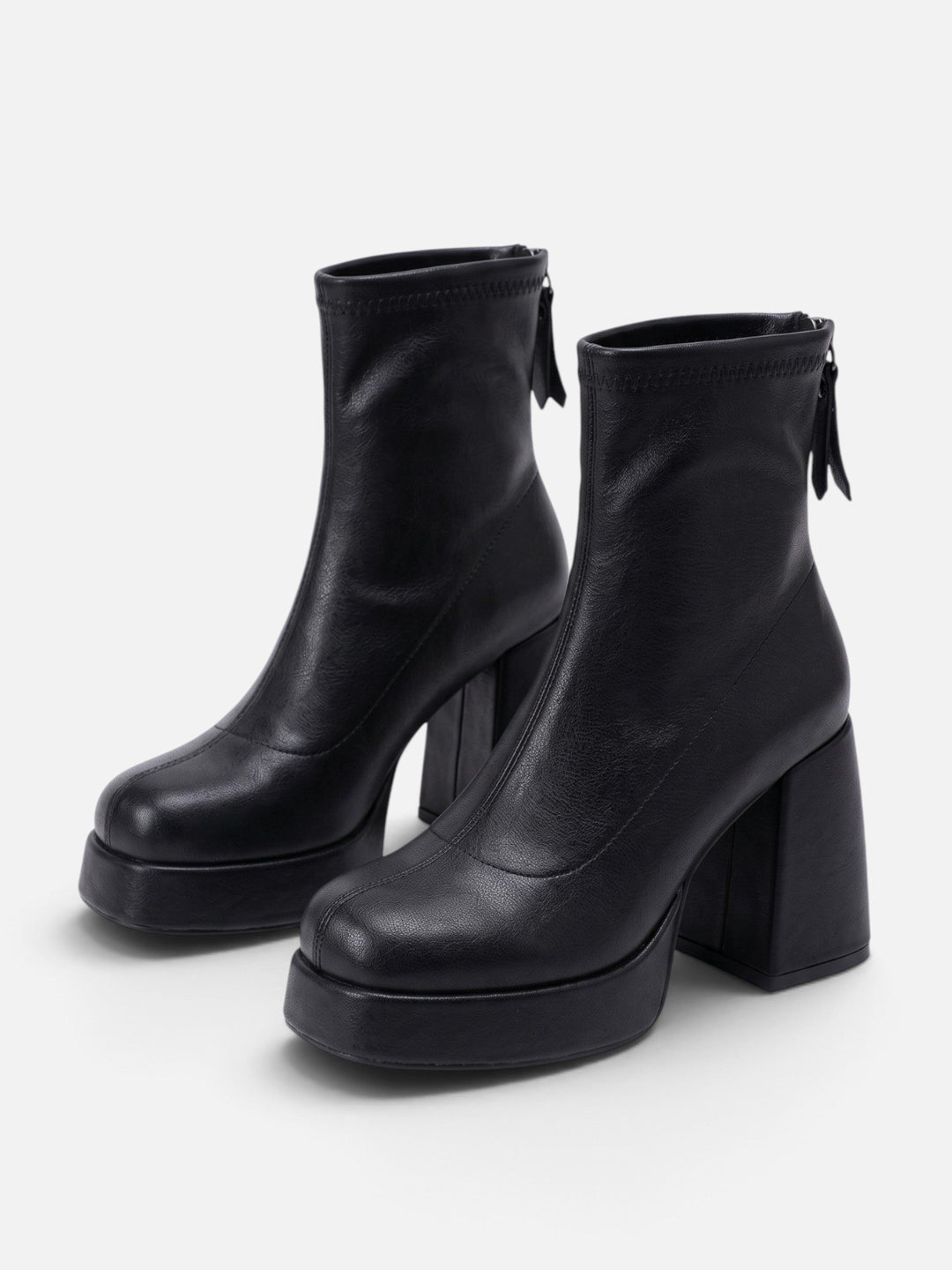Black platform ankle boots with thick sole and glossy finish