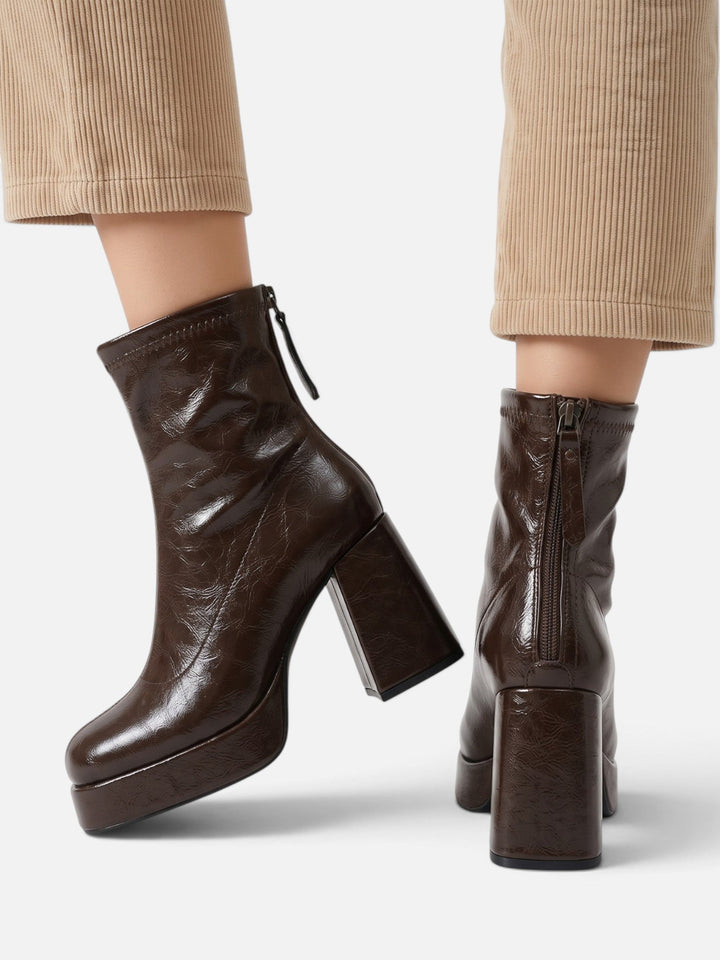 Dark brown platform boots showing the zip at the back